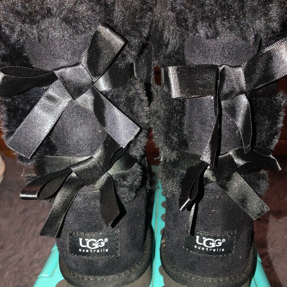 size 8 short black fuzzy Ugg boots with bows